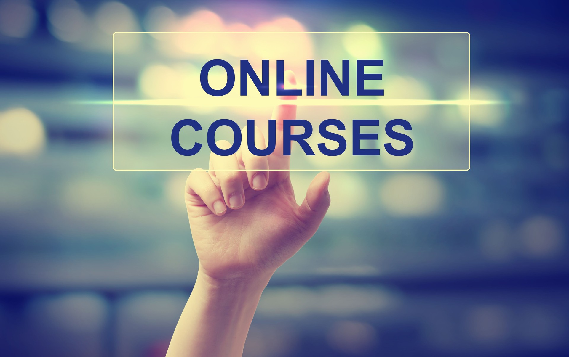 Hand pressing an online course button